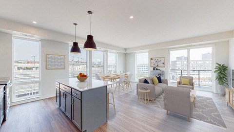 A modern kitchen with a dining table and chairs.