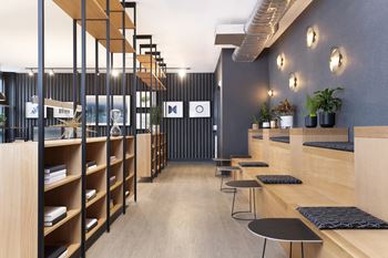 A modern interior with wooden shelves and black and white decor.