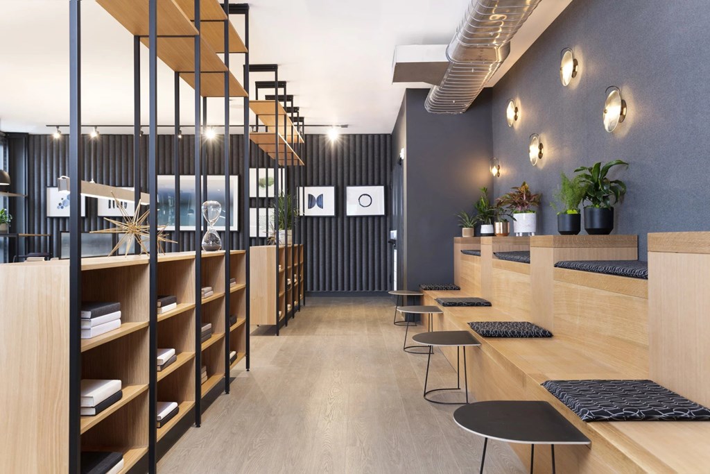 A modern interior with wooden shelves and black and white decor.