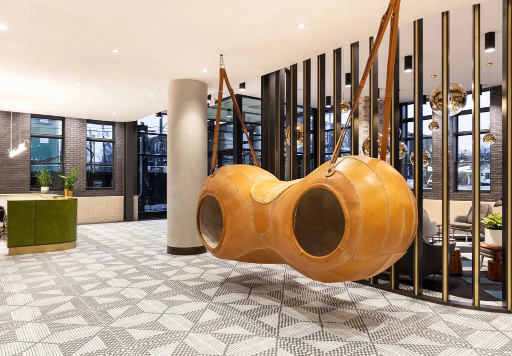 A large wooden structure in a room with a checkered floor.