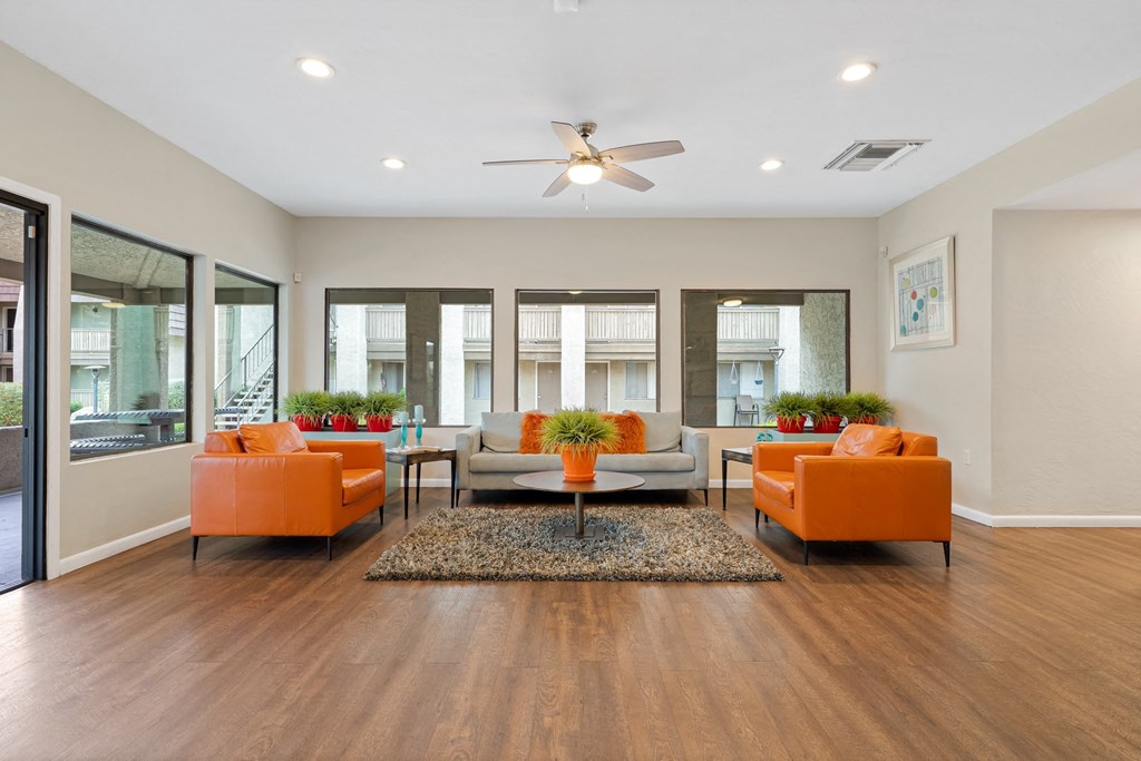 Living room with couches and a table at Verde Apartments in Tucson, AZ, 85719