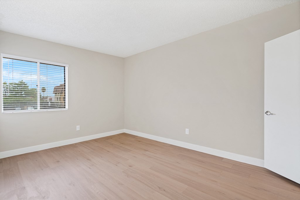 Bedroom with Carpet and Windows at Verde Apartments, Tucson, AZ