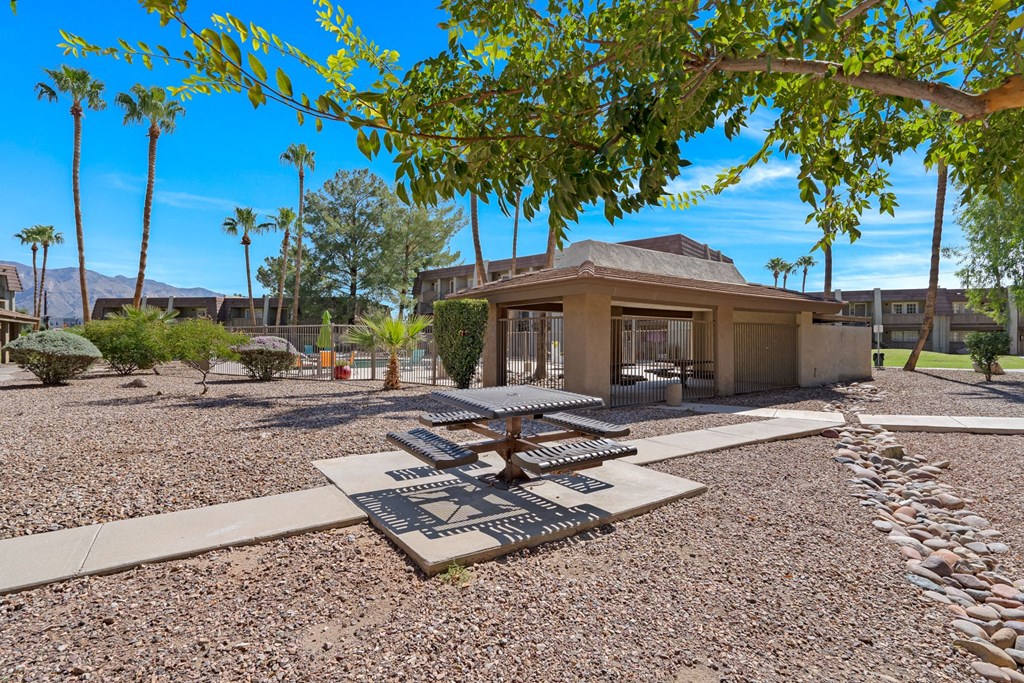 a view of a courtyard with trees and a building at Verde Apartments