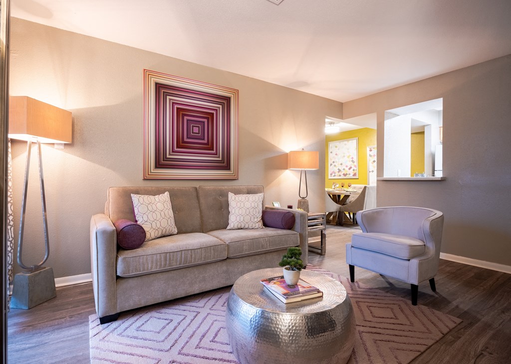 Living room with a couch chair and coffee table at Envue Apartments, Bryan, TX, 77802