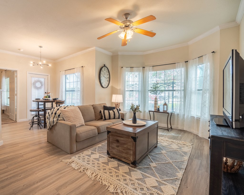 Living room with a couch and coffee table at Park Hudson Place Apartments, Bryan, TX, 77802