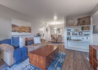 Living room with a couch and a coffee table  at Riverstone, Texas, 77802 - Photo Gallery 4