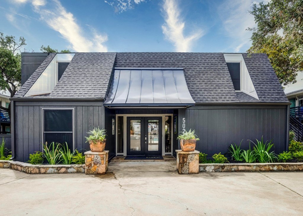 House with a black exterior and a gray roof  at The Wick, College Station, TX