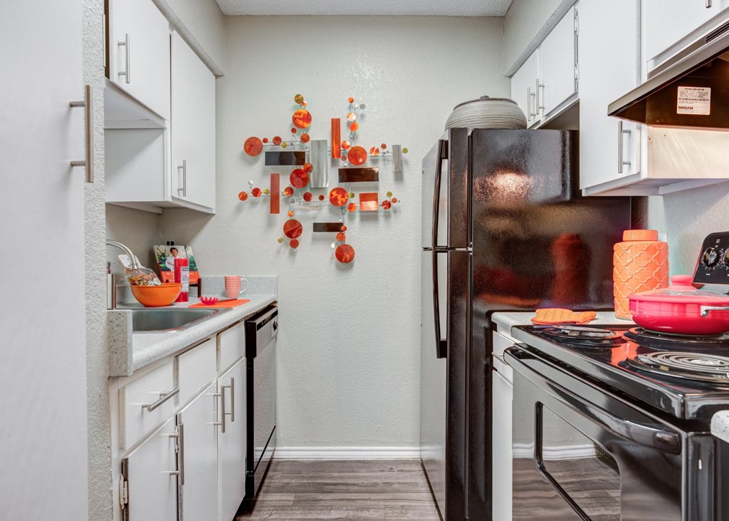 a kitchen with white cabinets at Sundance and Sausalito Apartments, College Station, 77840