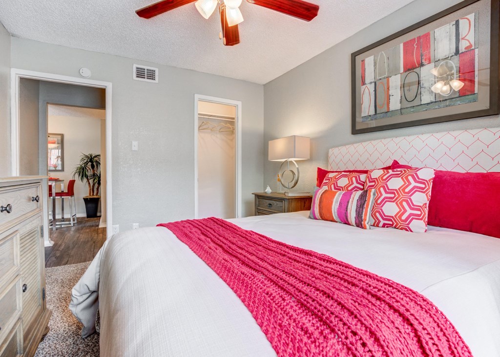a bedroom with a bed and a ceiling fan at Sundance and Sausalito Apartments, Texas, 77840