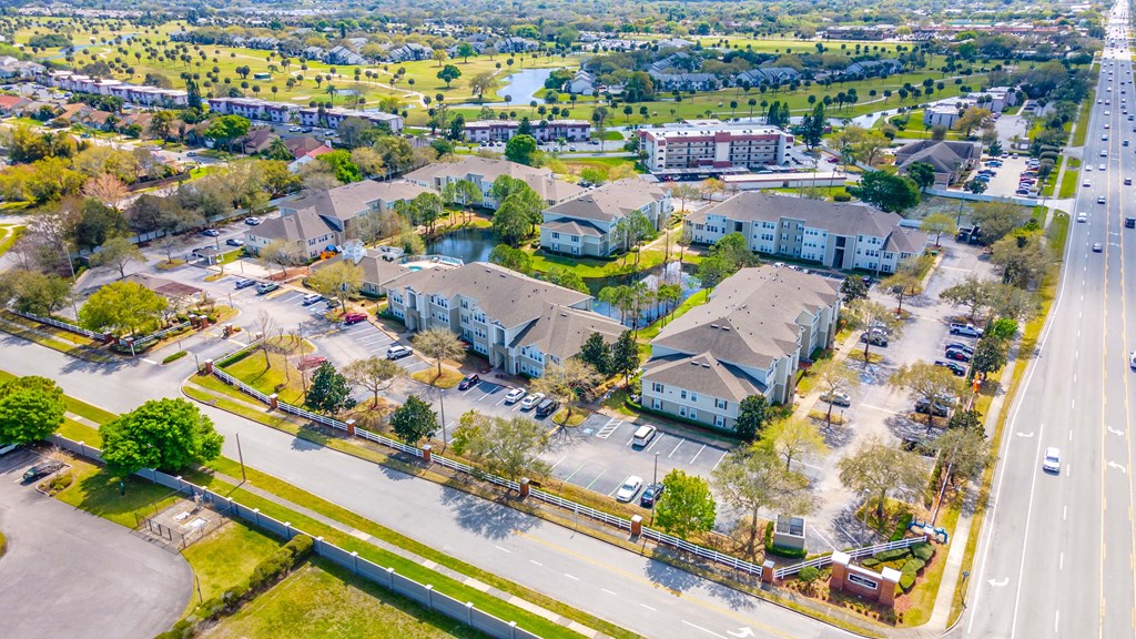 an aerial view of a neighborhood with houses and cars on the street
