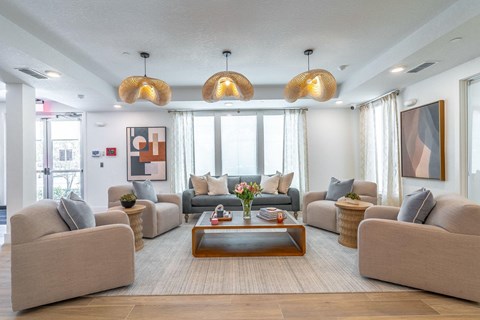 A living room with a large sectional sofa and a coffee table.