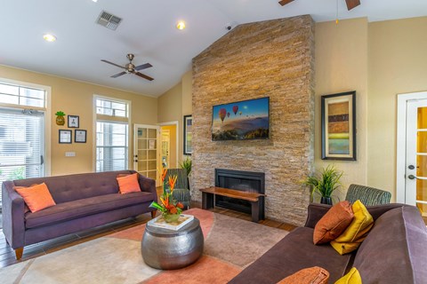 a living room with a couch and a fireplace