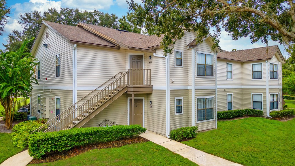 A two-story residential building with a staircase leading to the second floor.