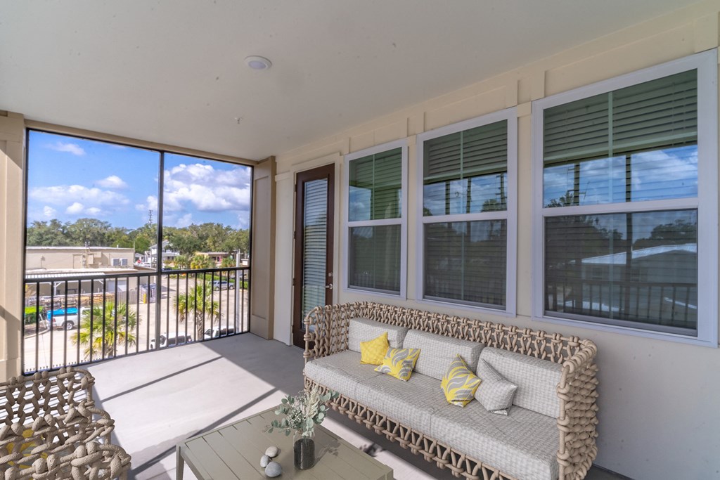 a living room with a couch and a balcony