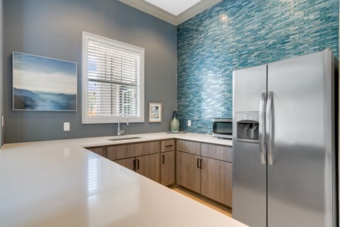 a kitchen with stainless steel appliances and a counter top