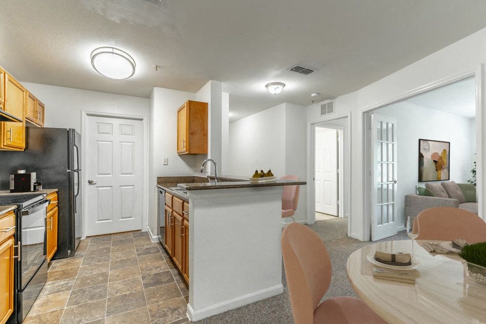 a kitchen with an island and a dining table