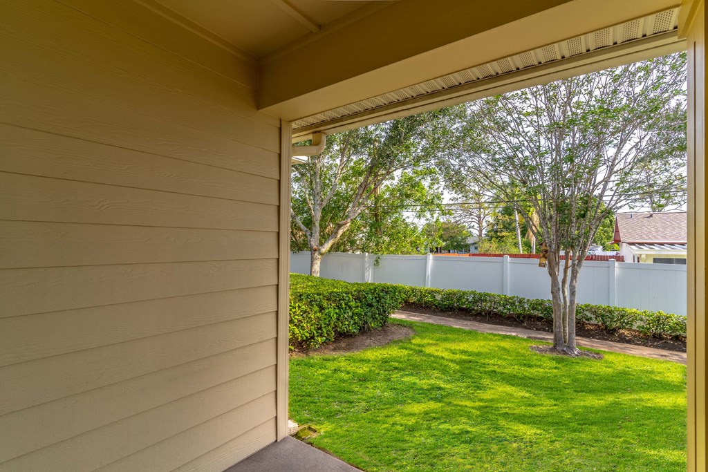 a view of the backyard from the front door of a house