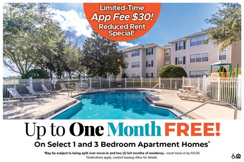 A pool and patio area of apartment complex with a sign offering a free month on select 1 and 3 bedroom apartments.