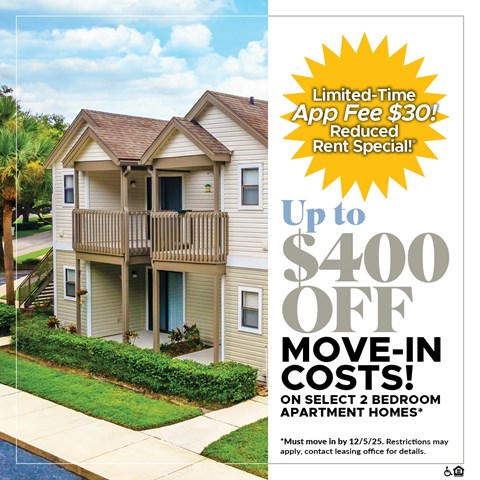 A two-story apartment building with a promotion for a limited-time app fee discount and move-in costs.