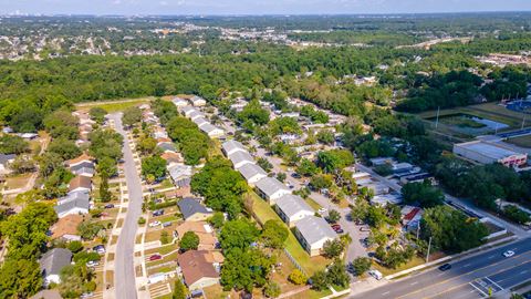 an aerial view of a neighborhood with houses and trees