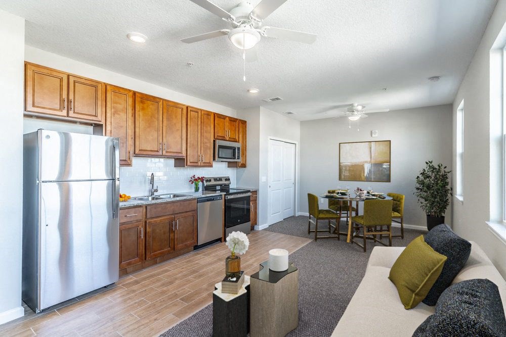 a living room with a kitchen and a dining room