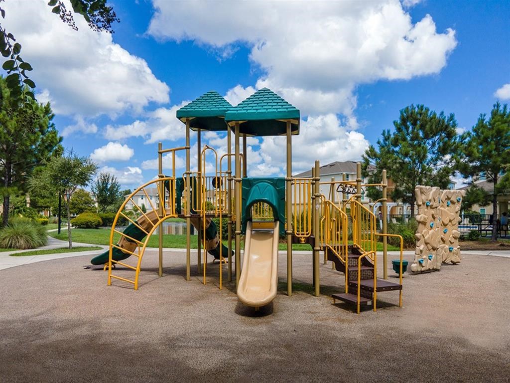a playground with a slide and climbing equipment