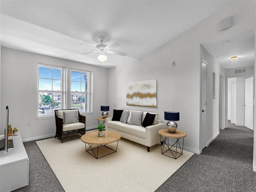 a living room with a couch and two tables