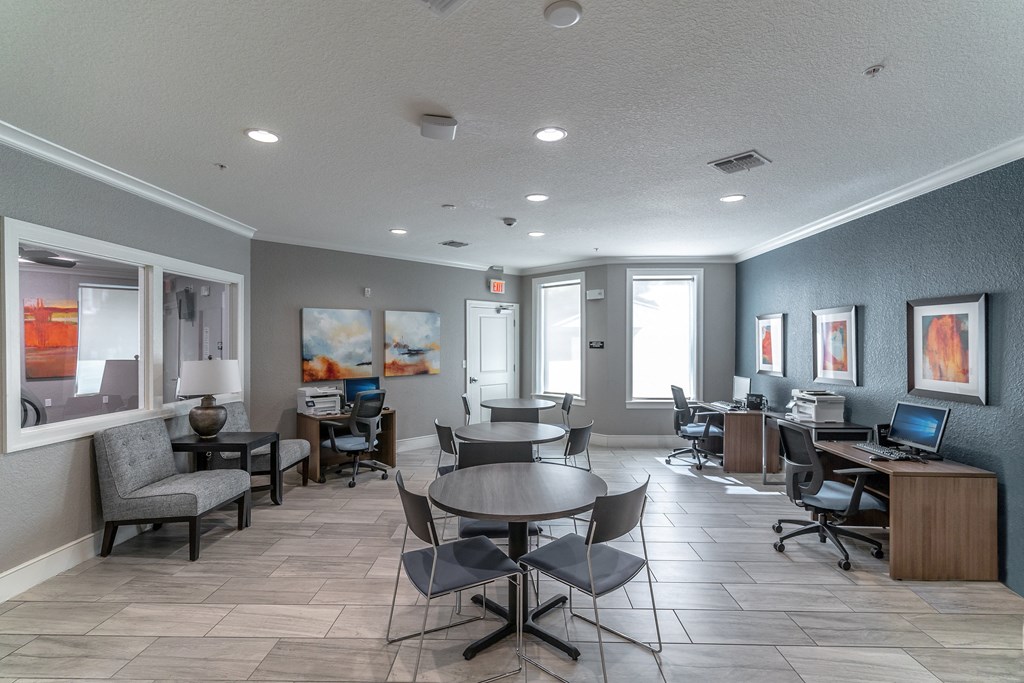 a resident clubhouse with tables and chairs