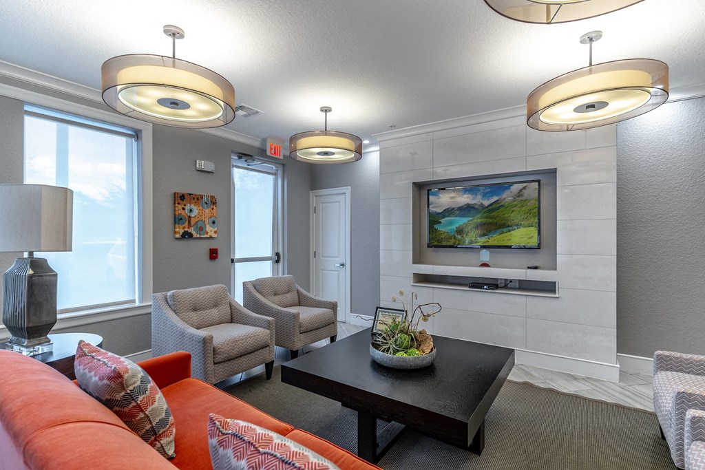 a living room with couches chairs and a coffee table
