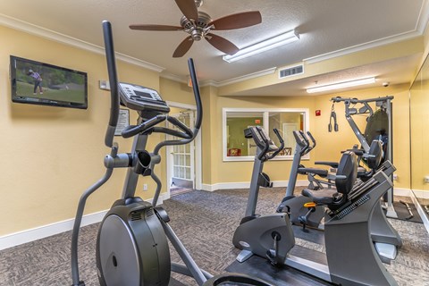 a fitness center with tv