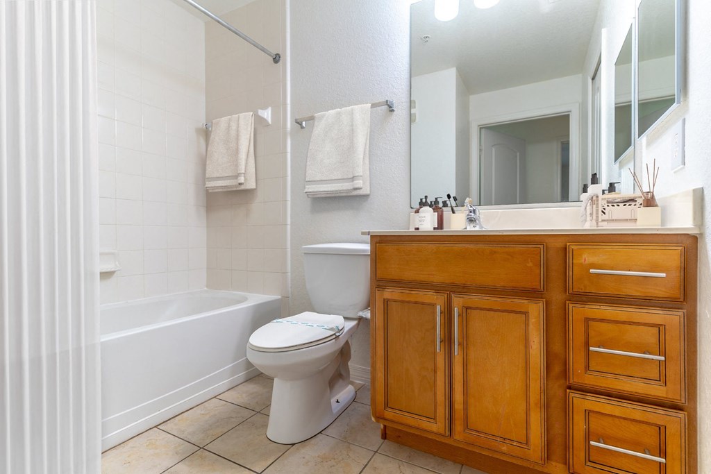 a bathroom with a toilet sink and bathtub