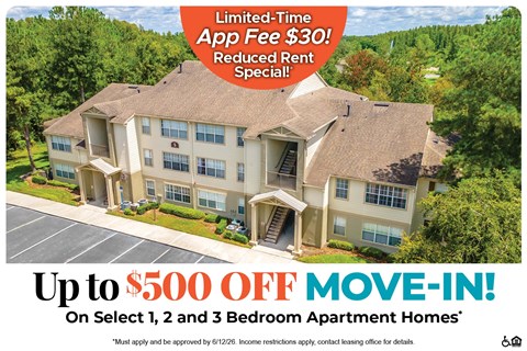 A large two-story apartment building with a red banner advertising a limited-time app fee of $30 and a move-in special.