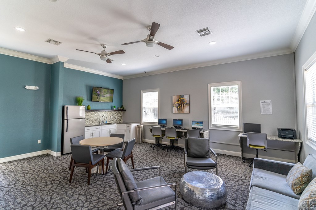 a room with couches and chairs and a table and chairs