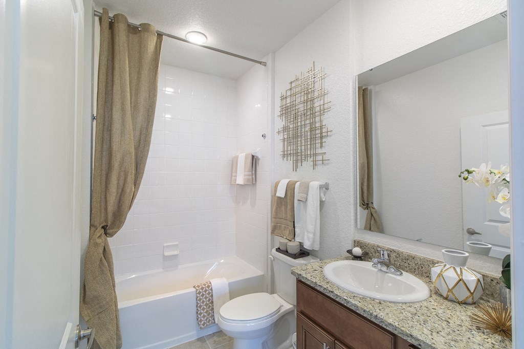 a bathroom with a toilet sink and bathtub