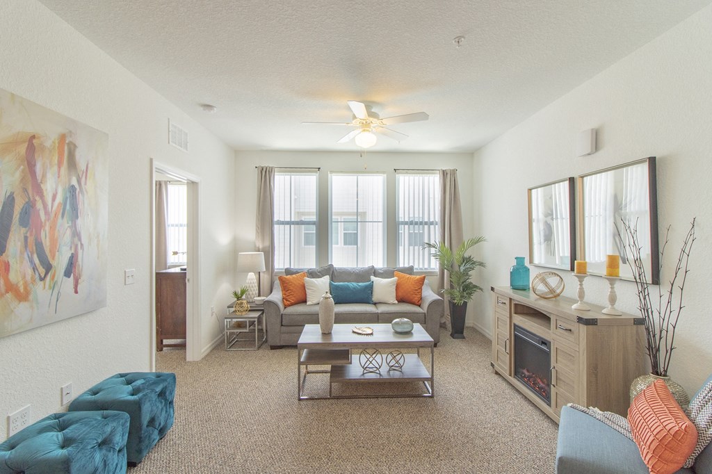 a living room with a couch coffee table and fireplace