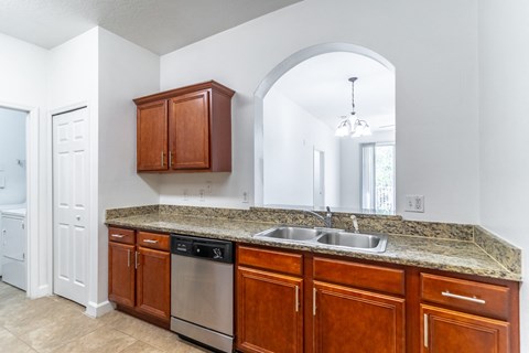 a kitchen with a sink and a dishwasher