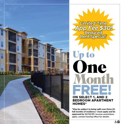 A building with a sign offering a free month on select bedroom apartments.