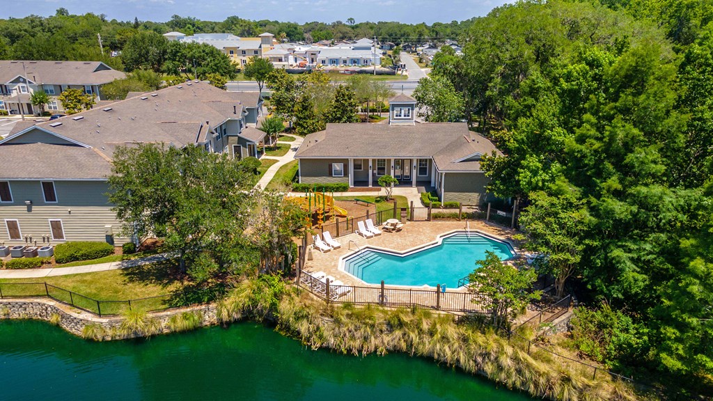 swimming pool in front of a body of water