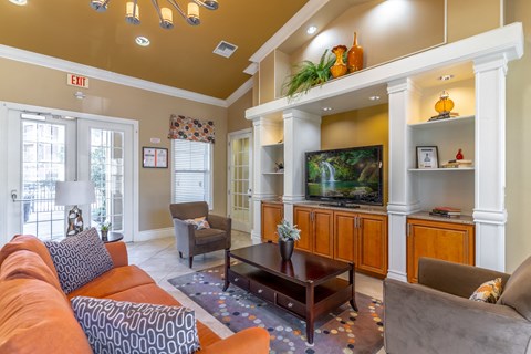 a living room with a couch and a television