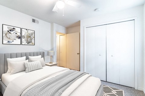 a bedroom with a bed and a wardrobe