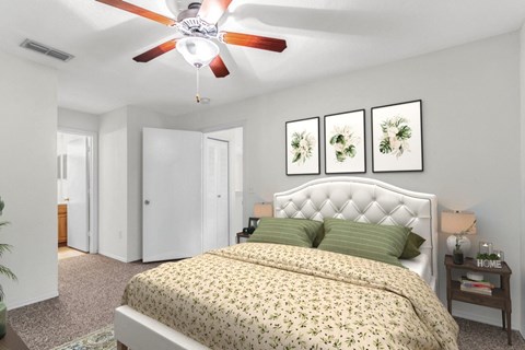 a bedroom with a bed and a ceiling fan