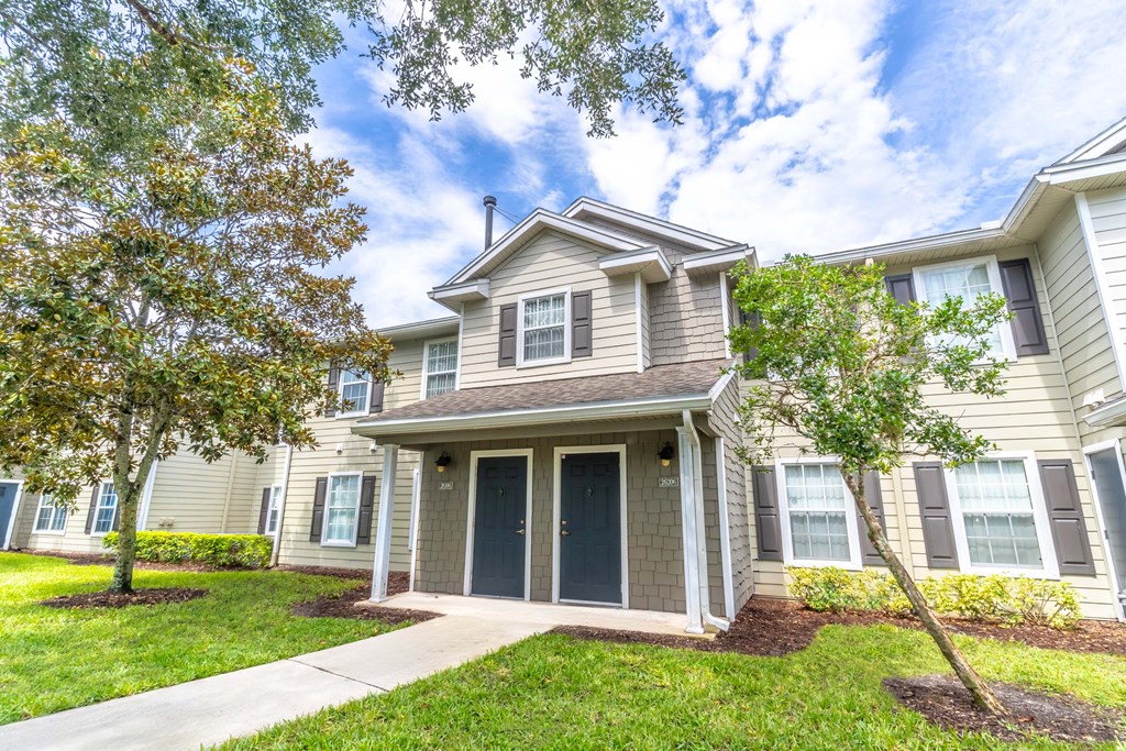 townhome exterior with lawn