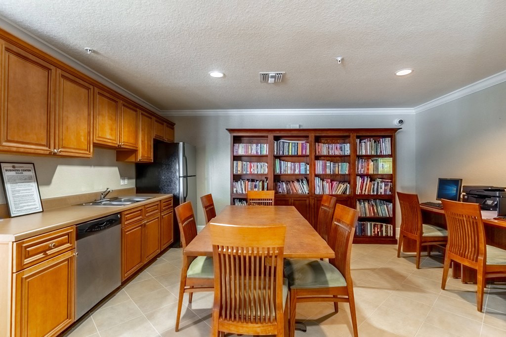 a kitchen and dining room with a table and chairs