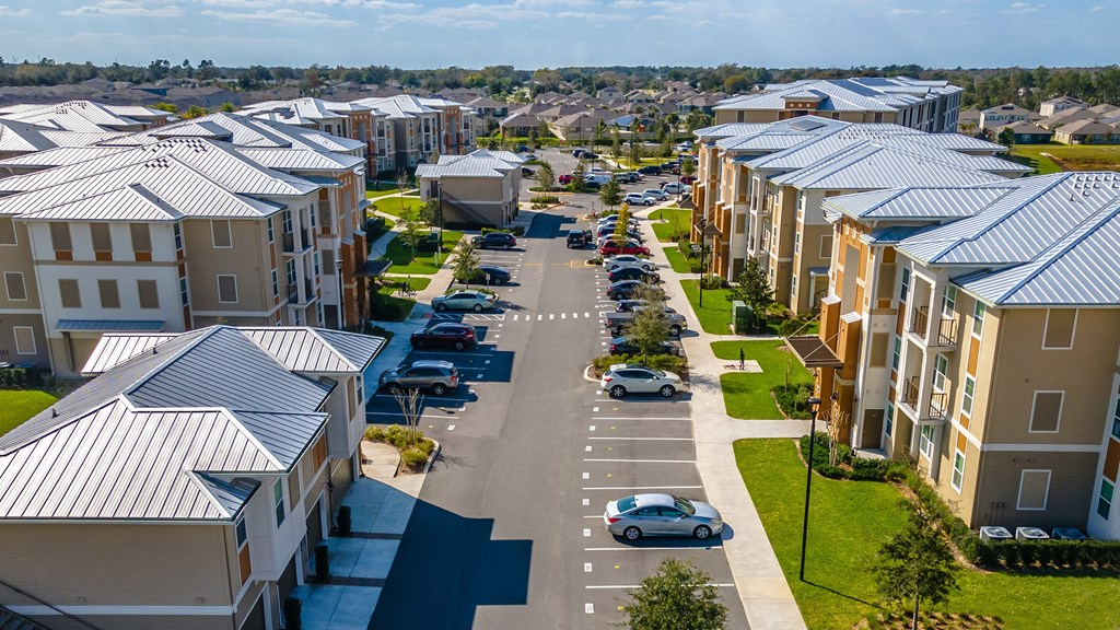 an aerial view of a street with rows of houses