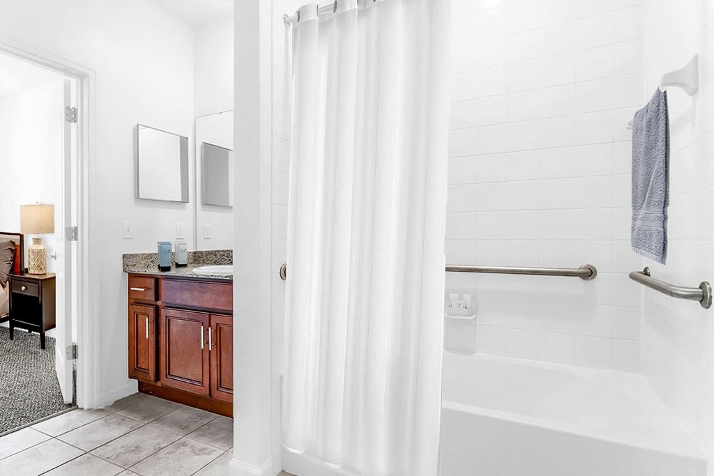 a bathroom with a bathtub and a sink