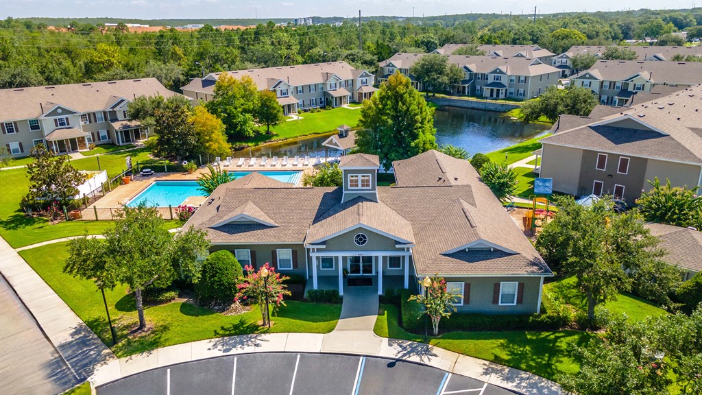 a large house with a swimming pool in front of it