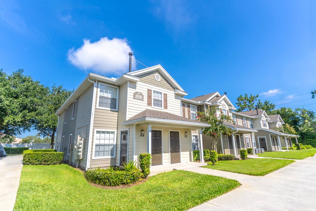 a large house with a blue sky in the background