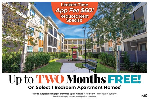 Apartment complex with a sign offering a free app and reduced rent.