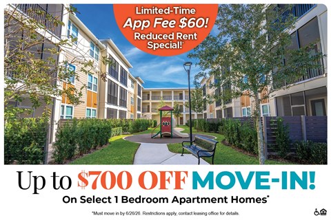 Apartment complex with a sign offering a limited-time app fee discount and a move-in special.