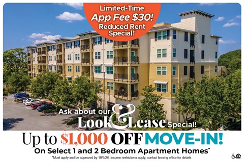 A large apartment complex advertises a limited-time app fee reduction and a move-in special.